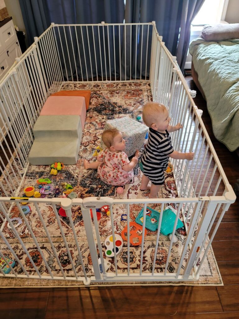 Twins playing in the new play yard